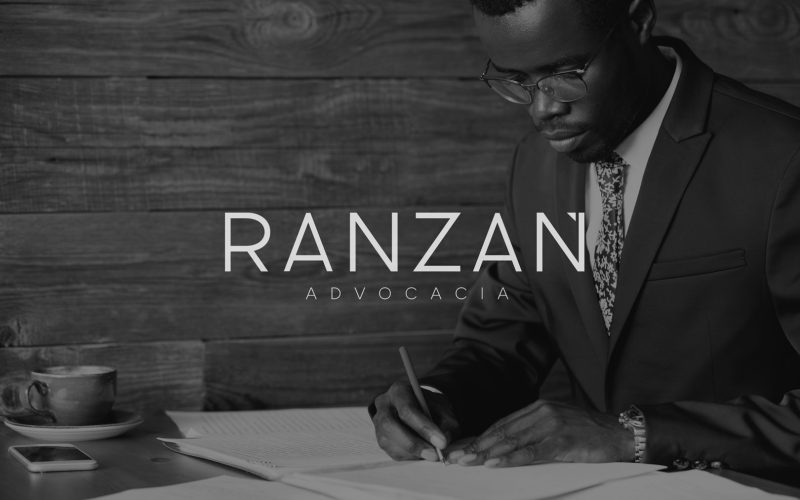 Serious black corporate worker in formal suit and spectacles sig